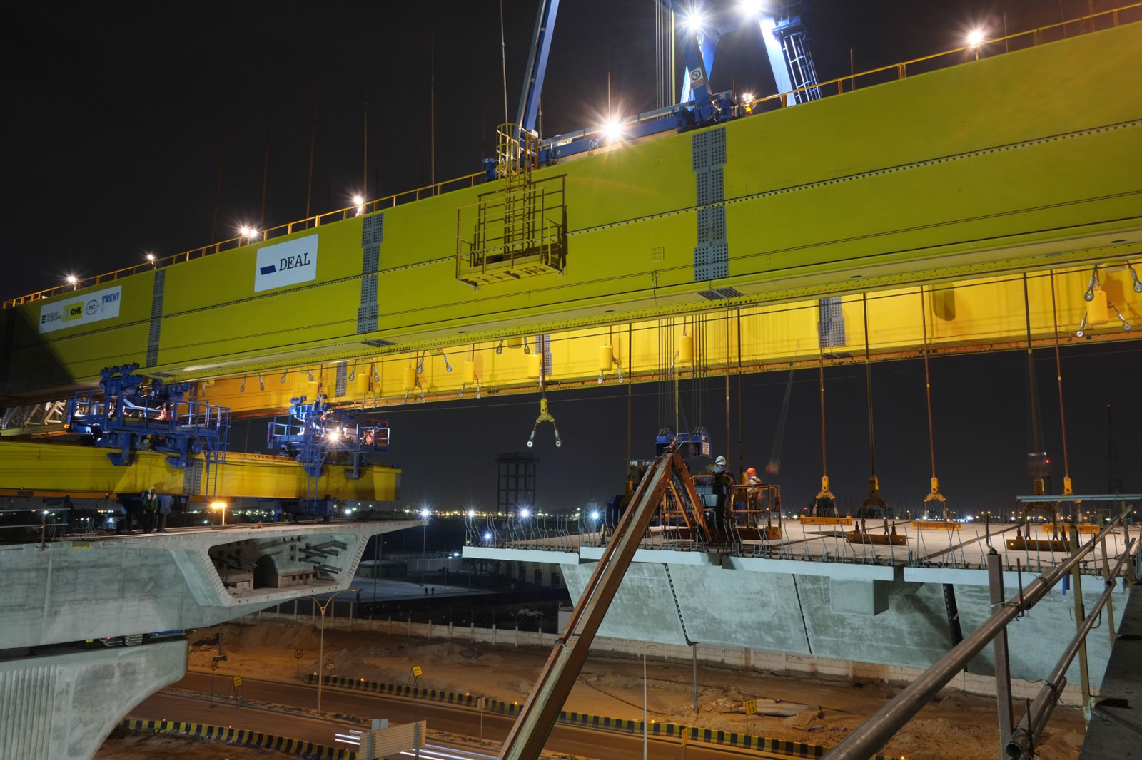 segmental bridge construction site by night